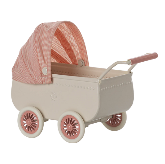 A vintage-style doll play pram in cream with a pink gingham canopy and pink accents on the wheels and handle, shown on a white background.